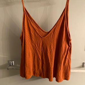 A burnt orange tank top